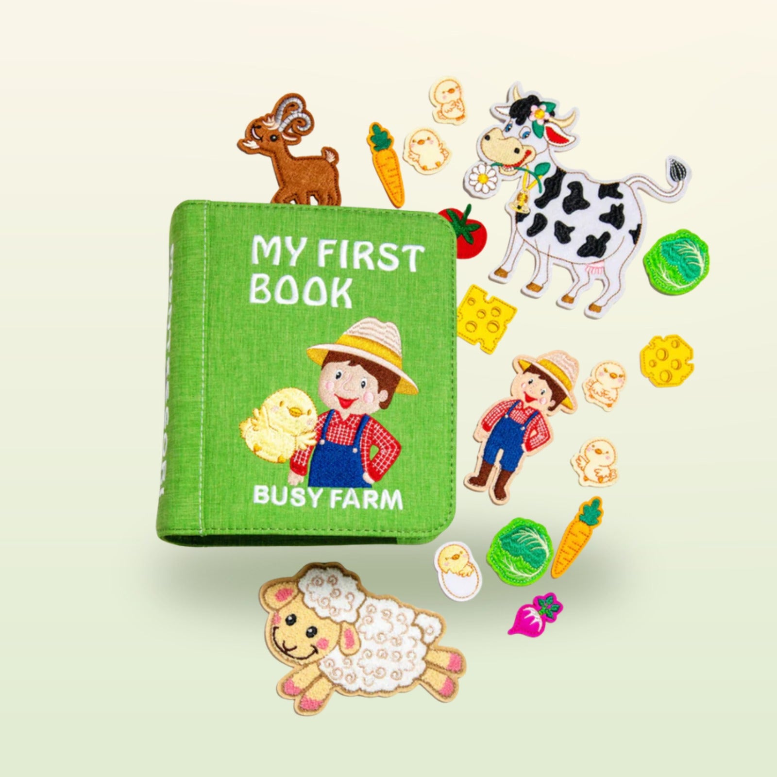 Busy Farm Quiet Book – Übersicht aller Stoffseiten und Spielelemente auf sanftem Wiesen-Hintergrund