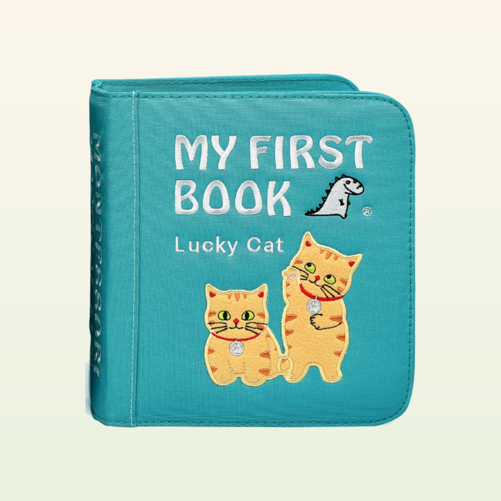 Lucky Cat Quiet Book geschlossen – teal MY-FIRST-BOOK-Cover mit zwei Kätzchen auf sanftem Creme-Hintergrund