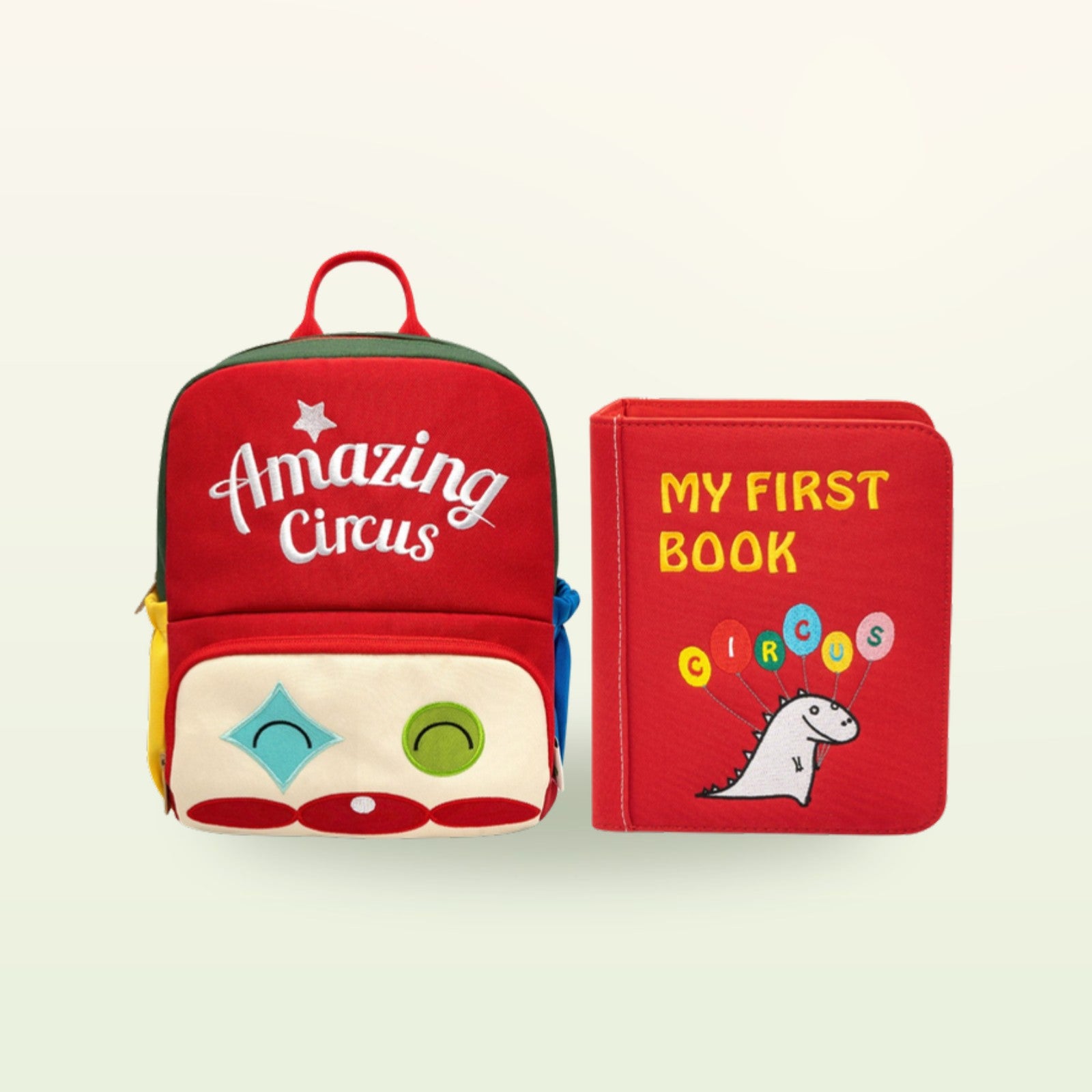 Zirkusabenteuer Quiet Book mit passendem rotem Amazing-Circus-Rucksack auf sanftem cremefarbenem Hintergrund – Stoffbuch ab 3 Jahren