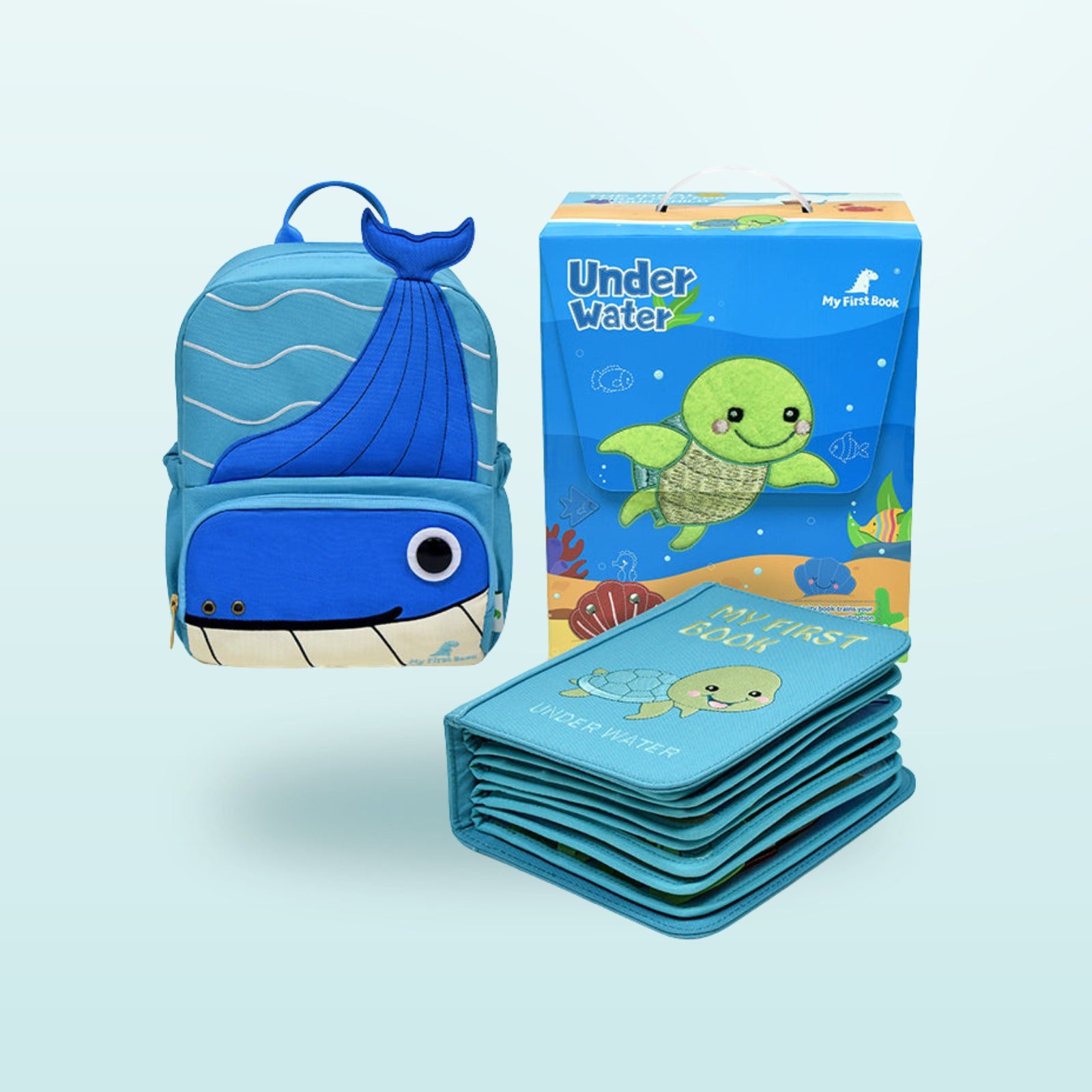 Unter Wasser Quiet Book Set mit blauem Wal-Rucksack, Filzbuch und Geschenkverpackung auf sanftem Meer-Hintergrund – komplettes Set ab 3 Jahren